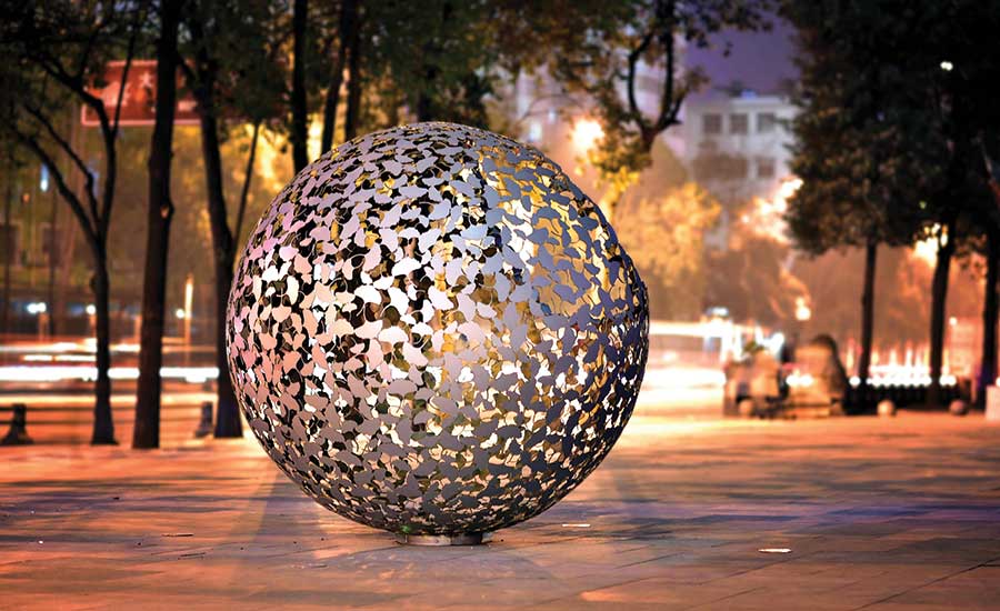 Bespoke sculpture for retail centre made of petals and glittering gold