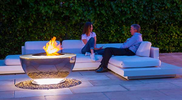 Fire Chalice water feature and fire pit being enjoyed outdoors