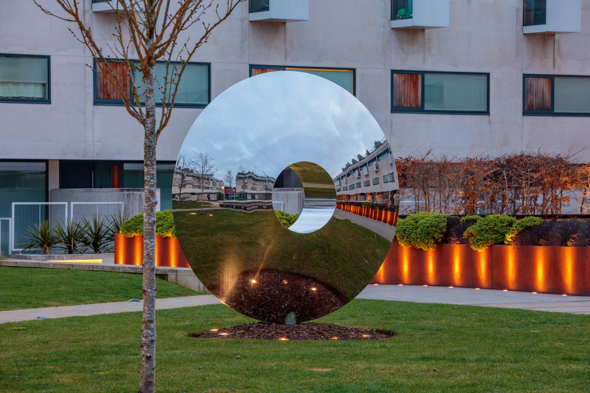 Large wind chime sculptures in a semi-circle in Korean style garden