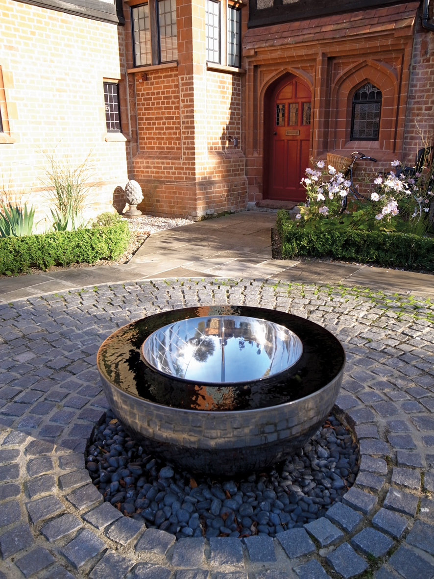 Dark Planet garden sculpture in traditional style courtyard - Contemporary  - Garden - Oxfordshire - by David Harber