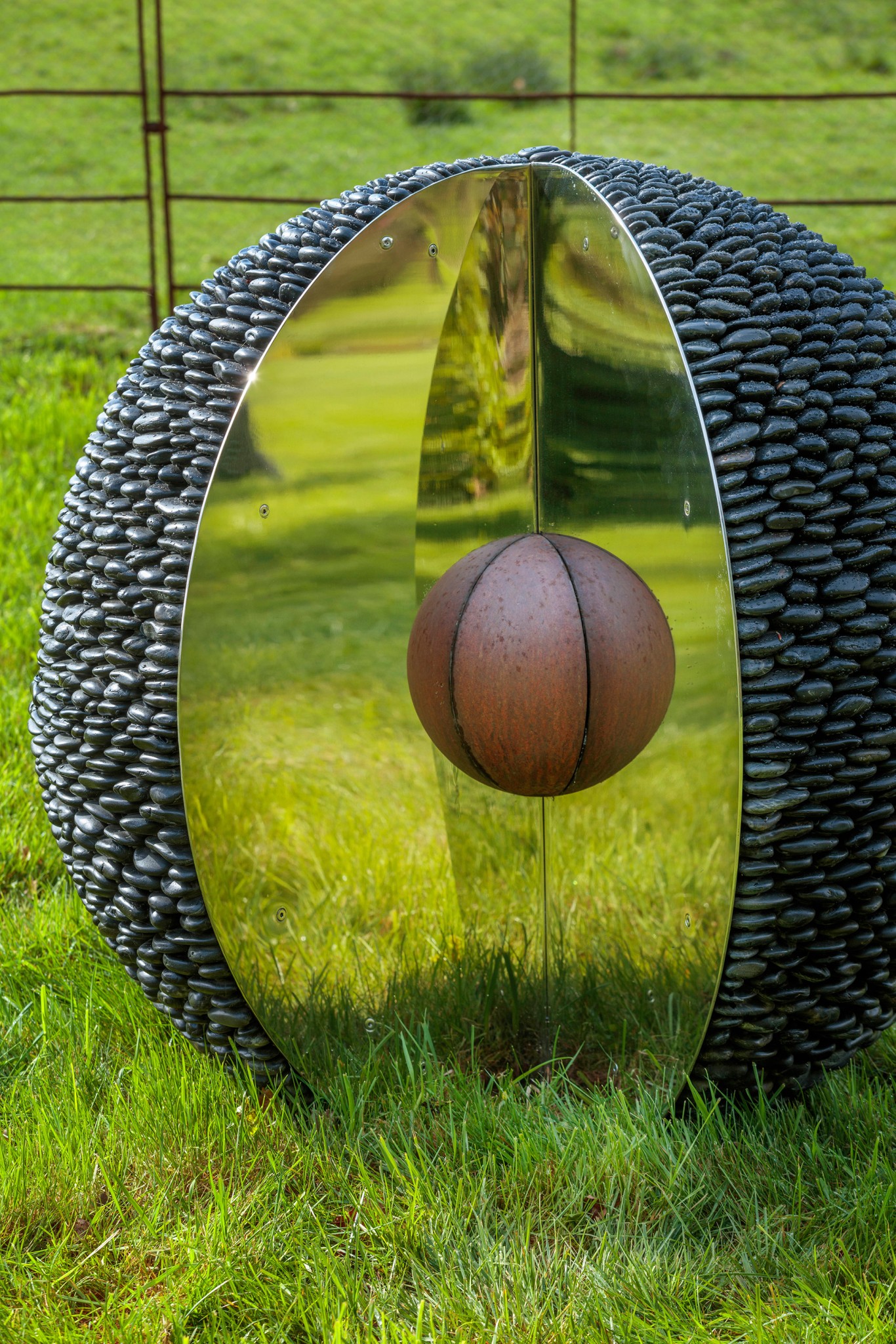 The kernel pebble sculpture bathed in the light of the setting sun