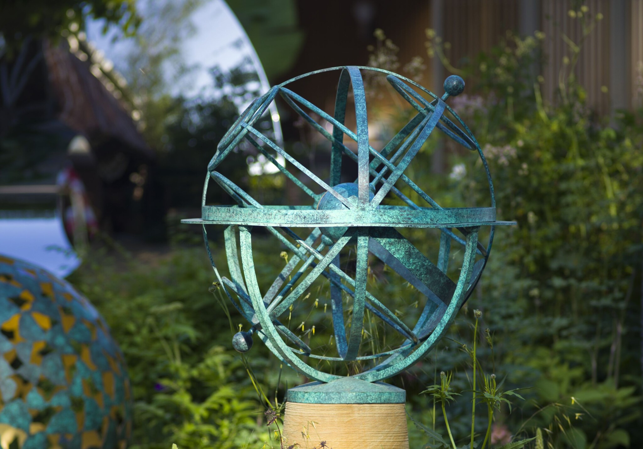 Brass armillary sphere in a beautiful lavender garden