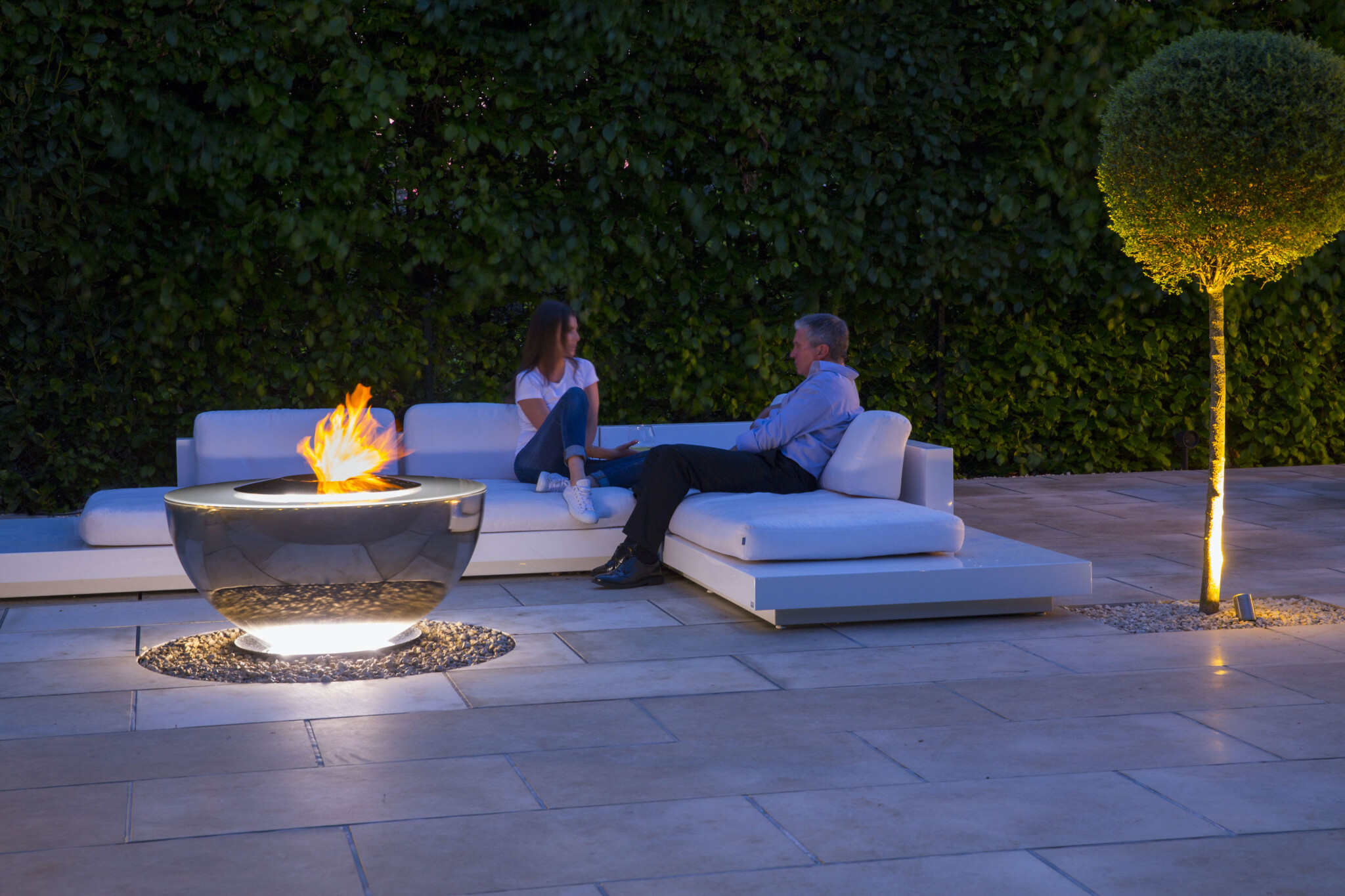 Fire Chalice water feature and fire pit being enjoyed outdoors