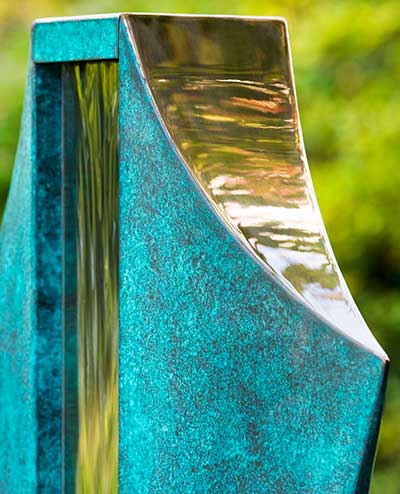 Detail of the bronze and stainless steel of the Volante water feature