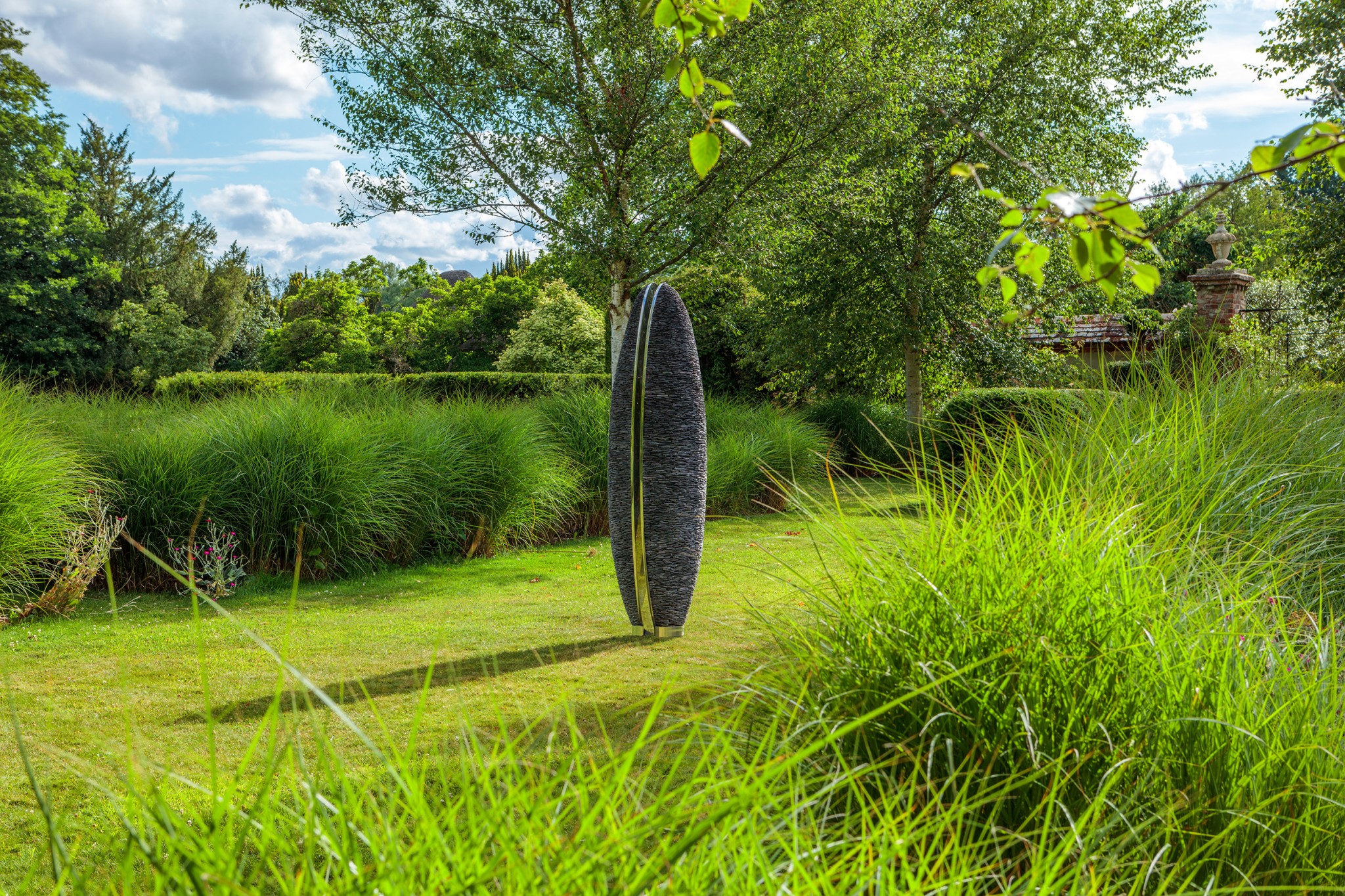 sentinel in lush green garden