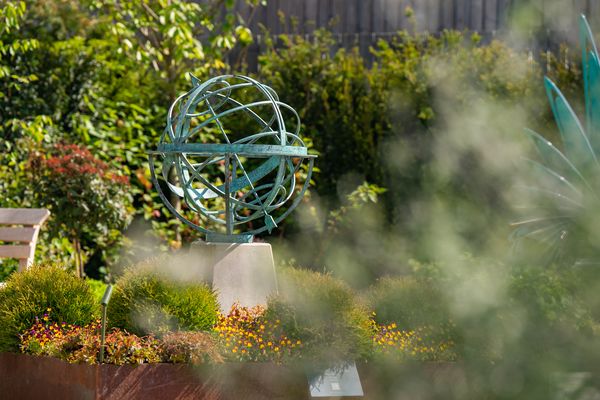 bronze verdigris armillary sphere in Lavershot Barns