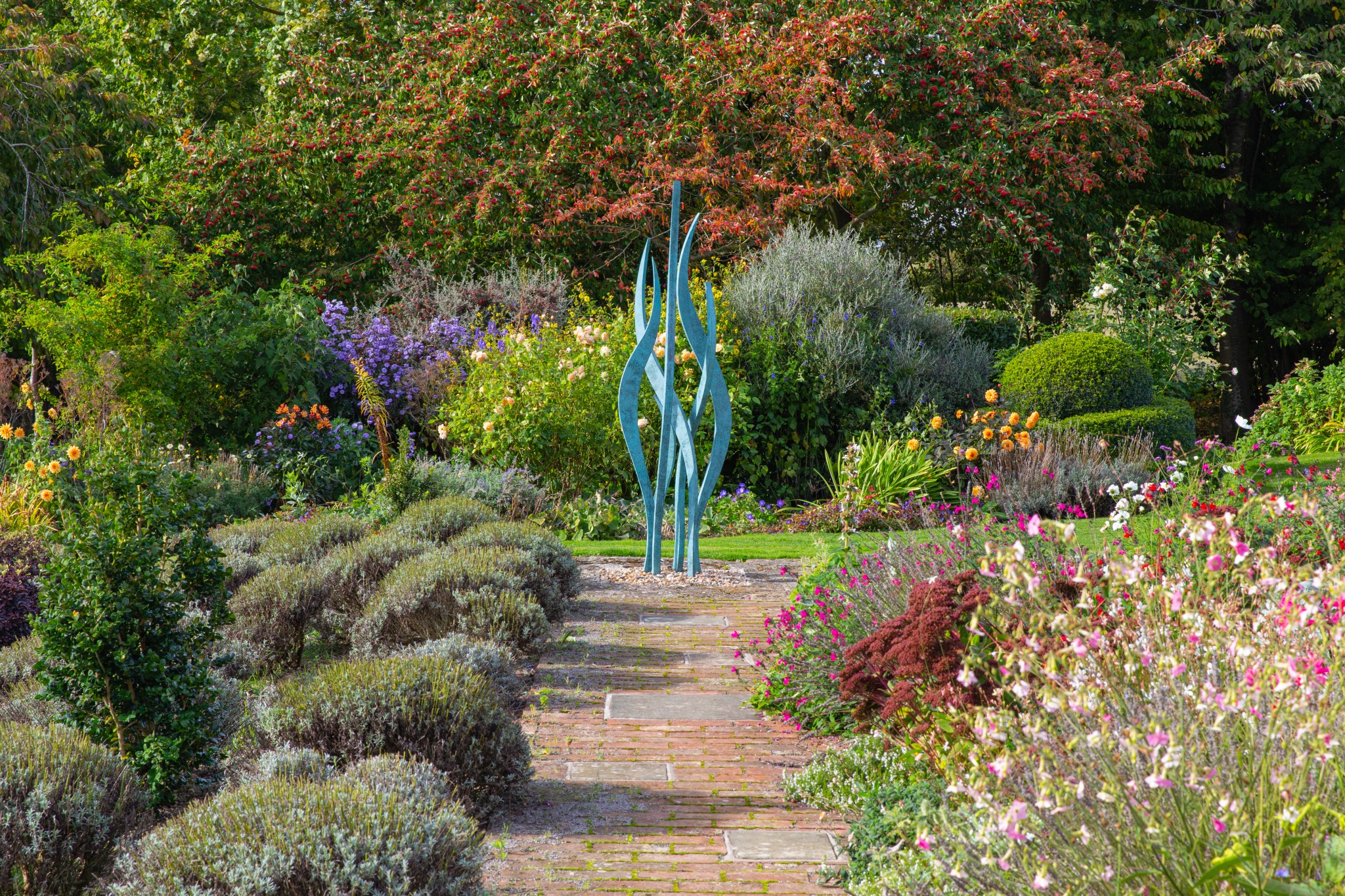 hydra in luscious floral garden