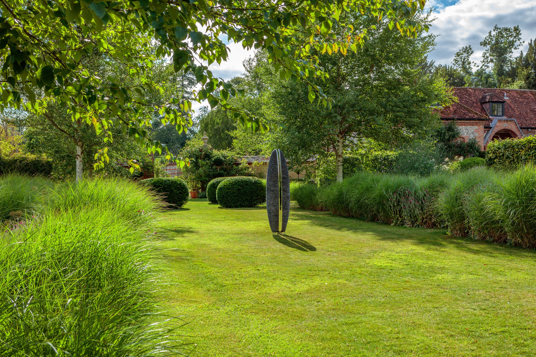 sentinel in green english garden