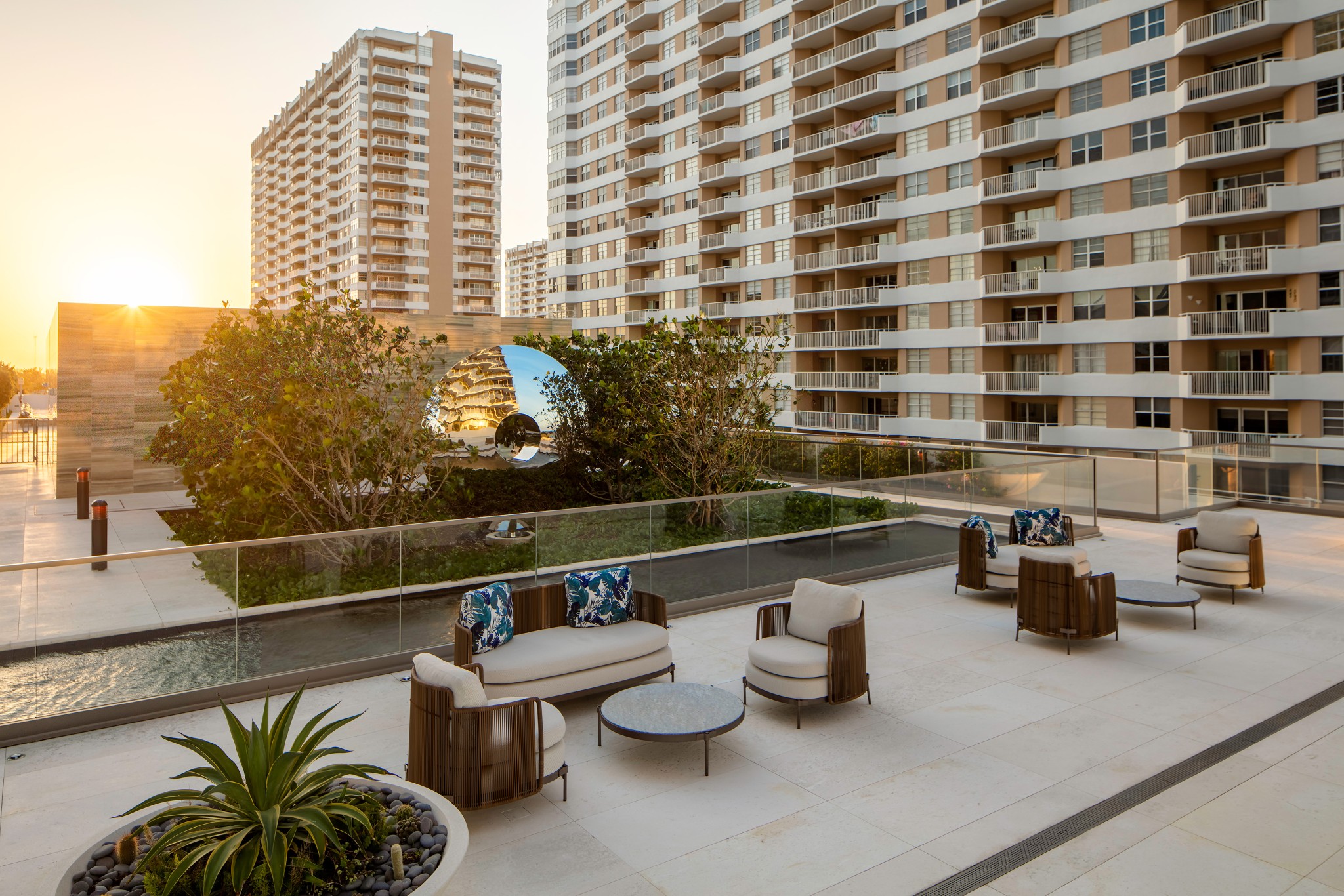 stainless steel torus in contemporary rooftop setting
