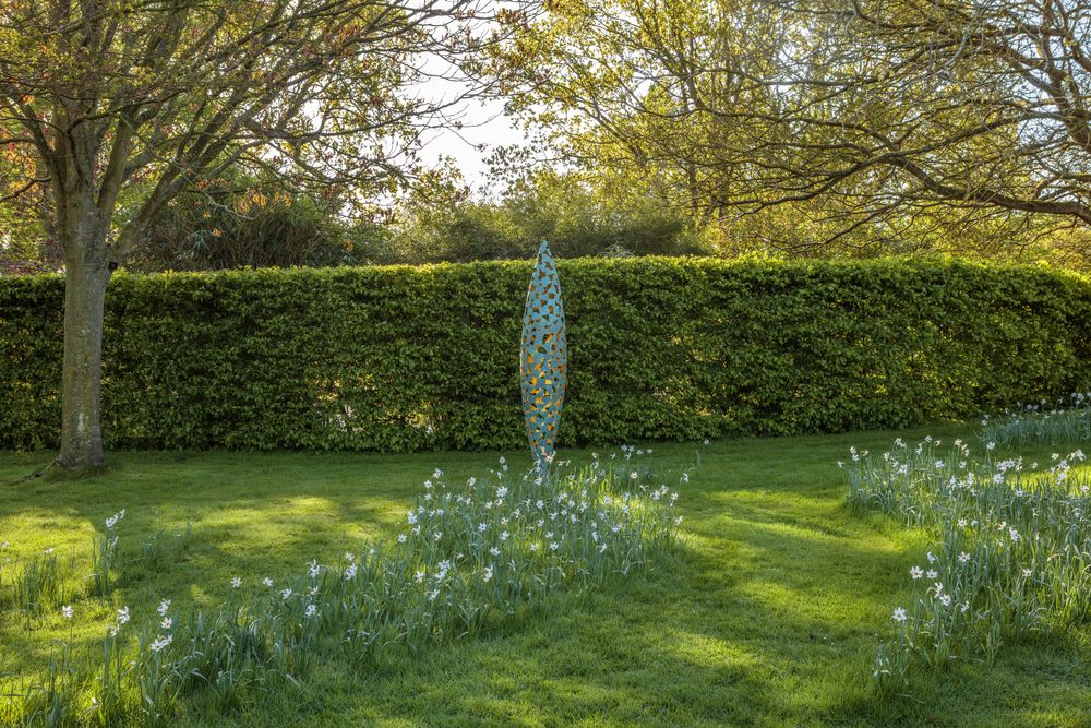 Quill landscape sculpture in bronze and gold at Helmingham Hall