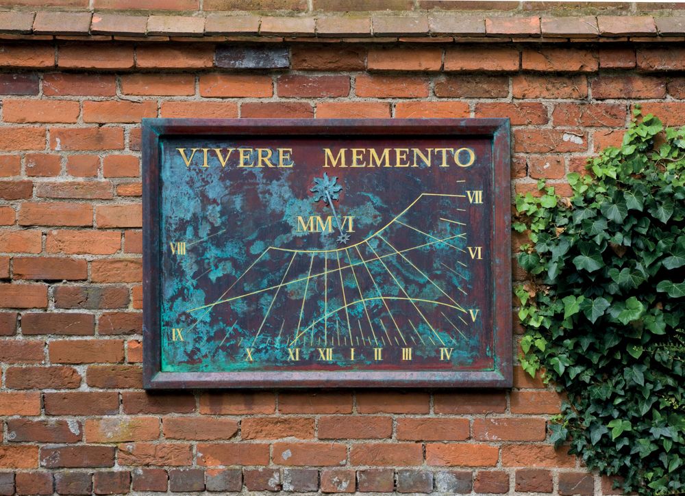 custom verdigris copper vertical sundial created by the British sculptor and clockmaker David Harber